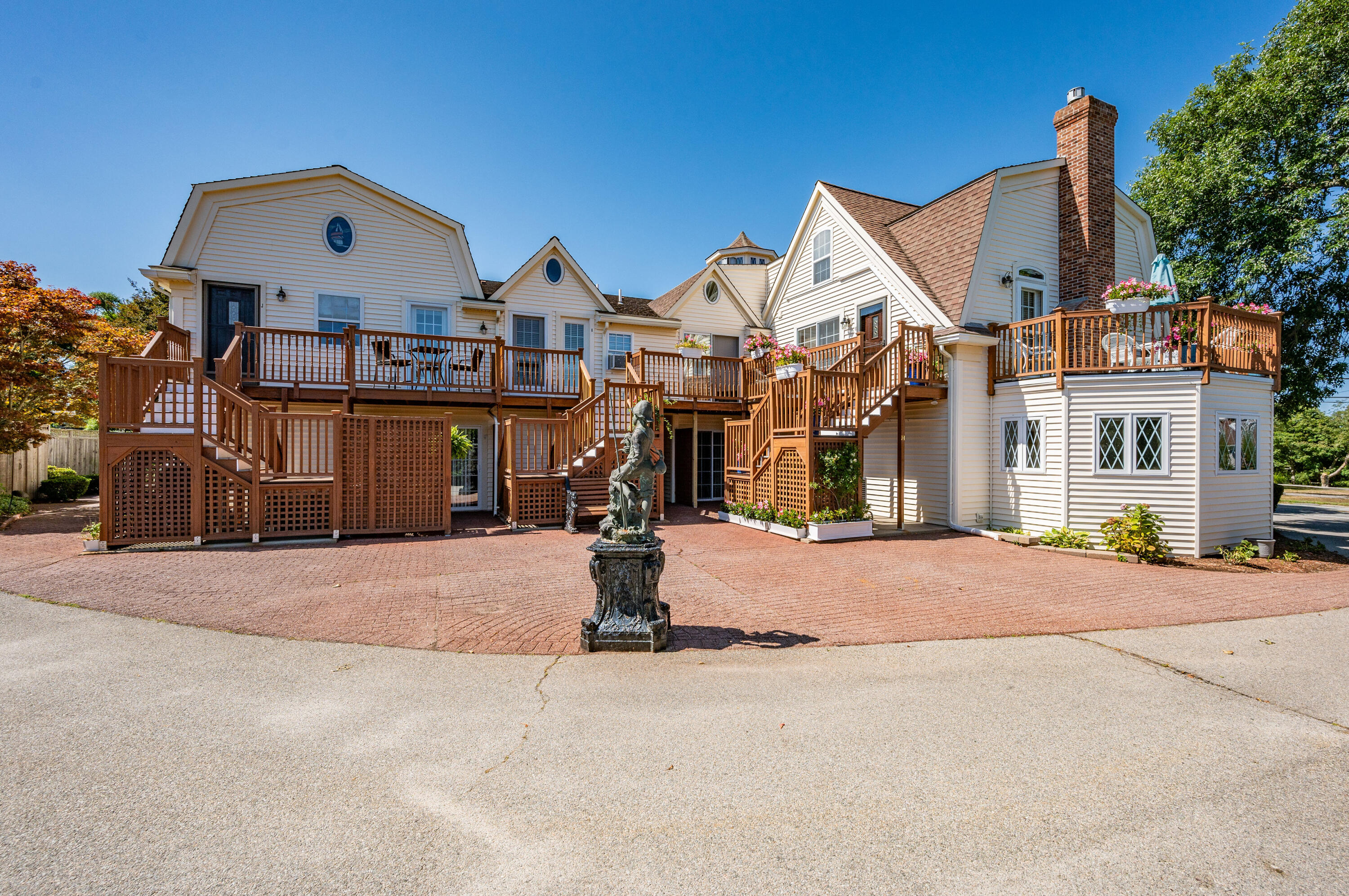 403 Lower County Road, Unit J Harwich Port, MA 02646 - Photo 8 of 26 a front view of a house with a yard