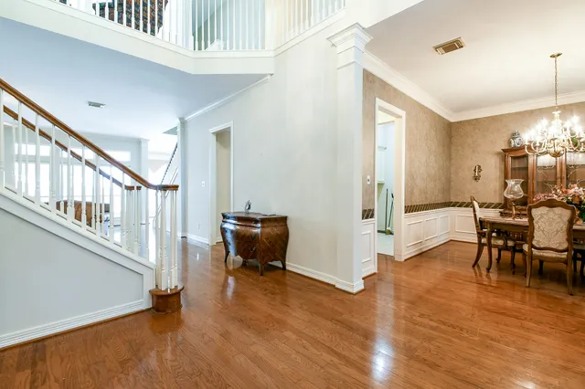 a view of a livingroom with furniture and hardwood floor