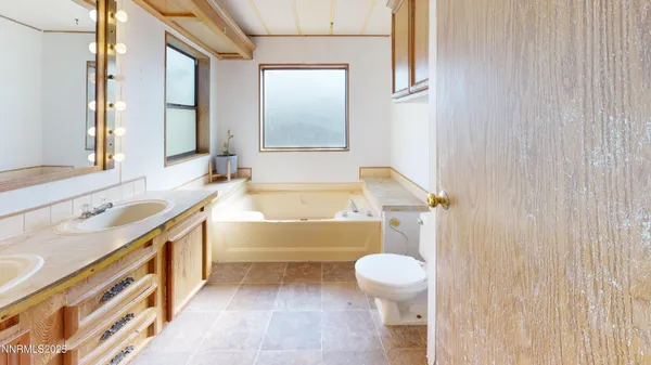 a bathroom with a sink a toilet and a bathtub
