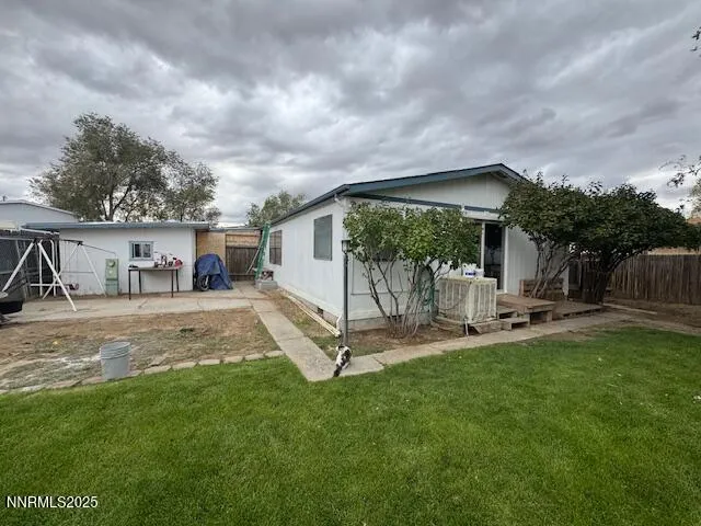 a view of a backyard with a car parked in it