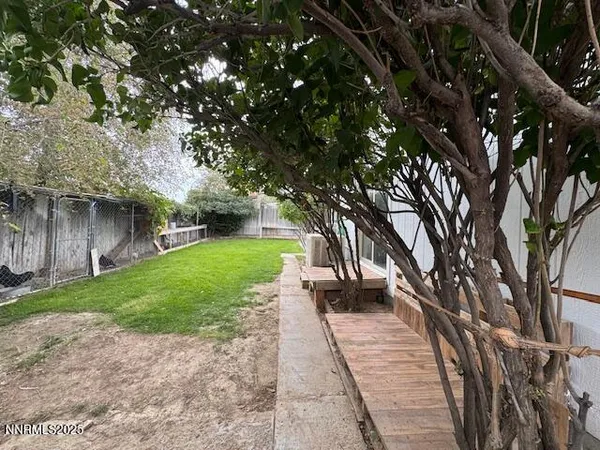 a view of a backyard with furniture