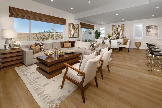 a living room with furniture and a lamp