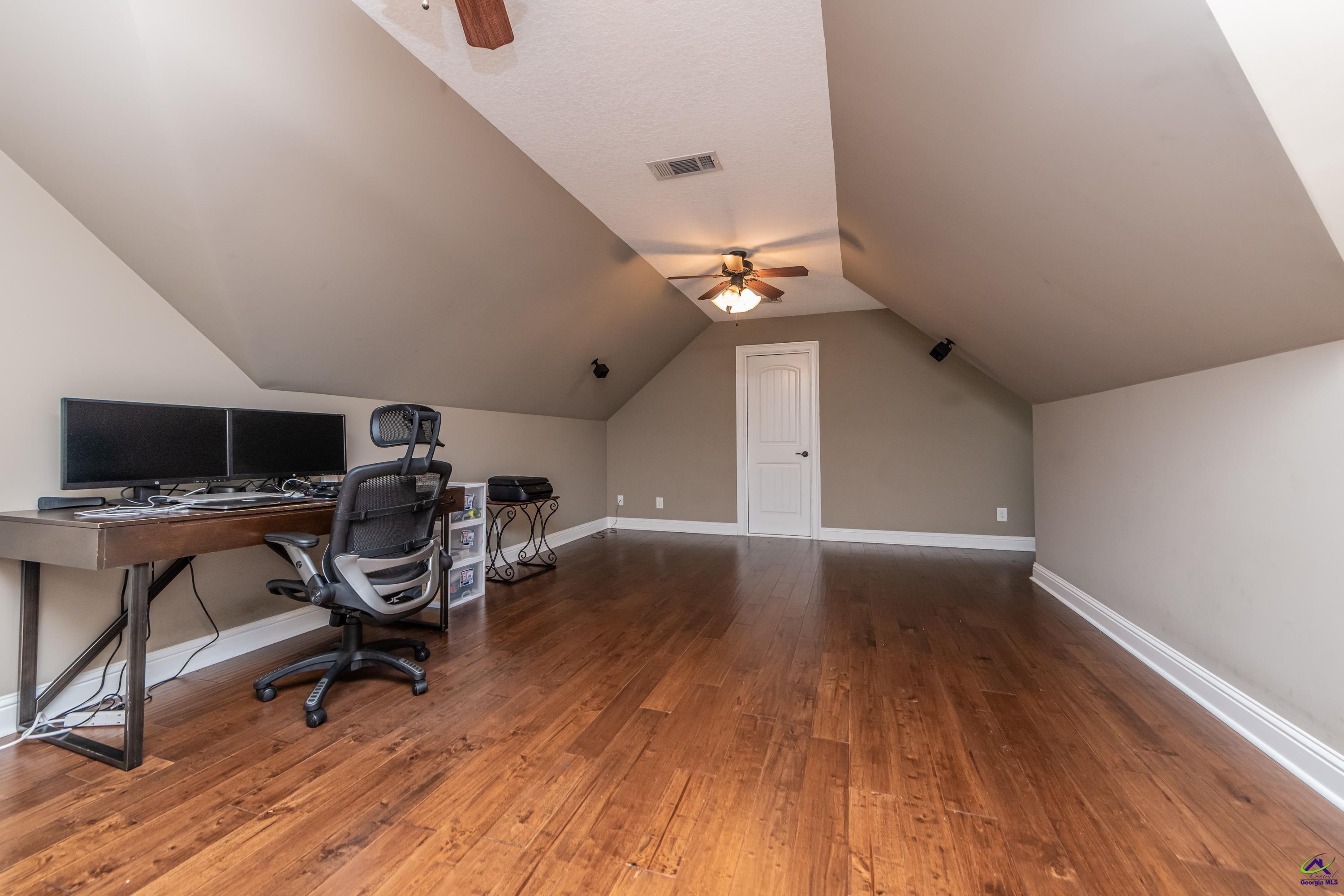 405 Old Bridge Road Warner Robins, GA 31088 - Photo 43 of 58 a view of a workspace with wooden floor and a window