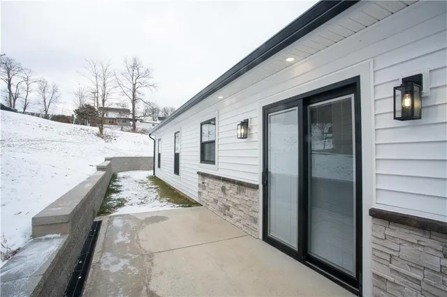 a view of a house with a snow in the yard