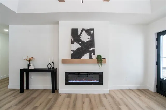 a view of an empty room and wooden floor