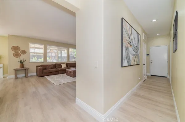 a kitchen with stainless steel appliances a refrigerator and a stove top oven