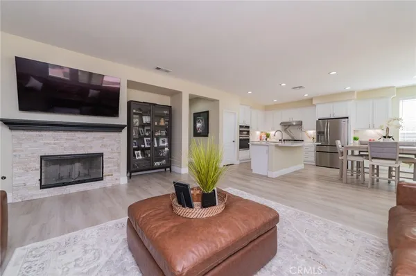 a view of a livingroom with a furniture and a view of bedroom