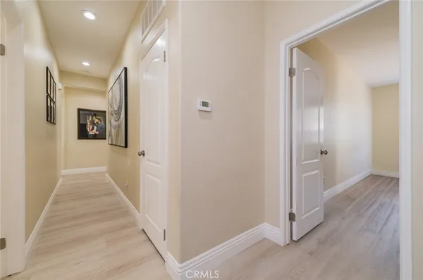 a spacious bathroom with a shower sink and mirror