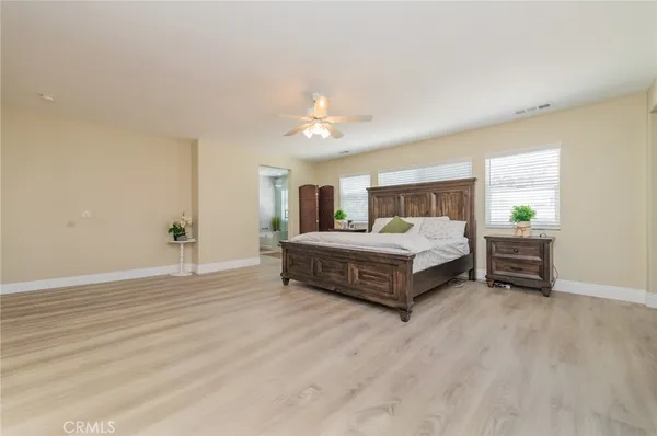 a bedroom with a bed and a closet