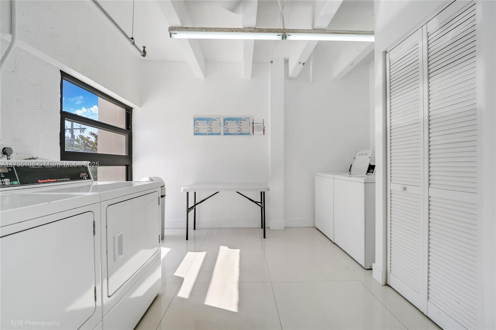 575 Crandon Boulevard, Unit 306 Key Biscayne, FL 33149 - Photo 16 of 18 a bathroom with a sink a mirror and a bathtub