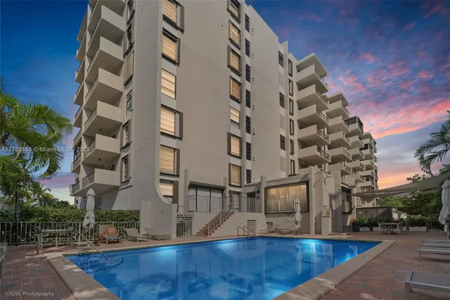 a view of buildings with yard