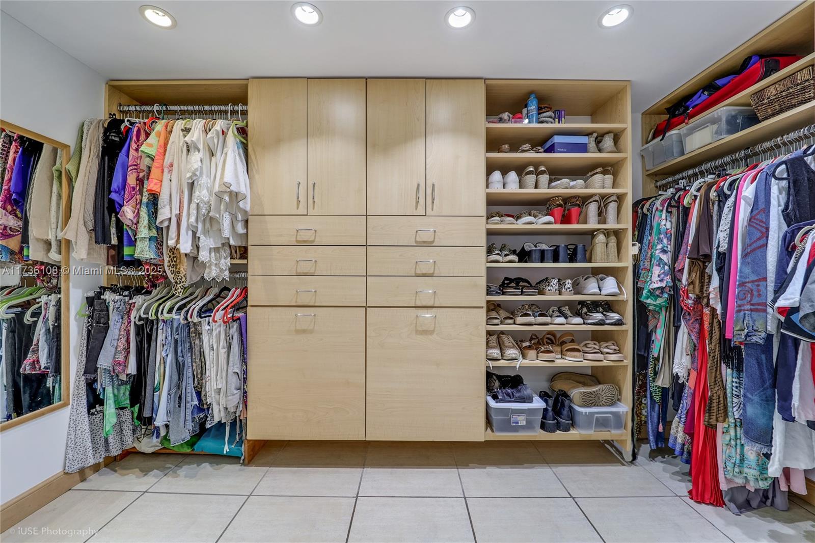 575 Crandon Boulevard, Unit 306 Key Biscayne, FL 33149 - Photo 10 of 18 a view of walk in closet with clothes and shoes
