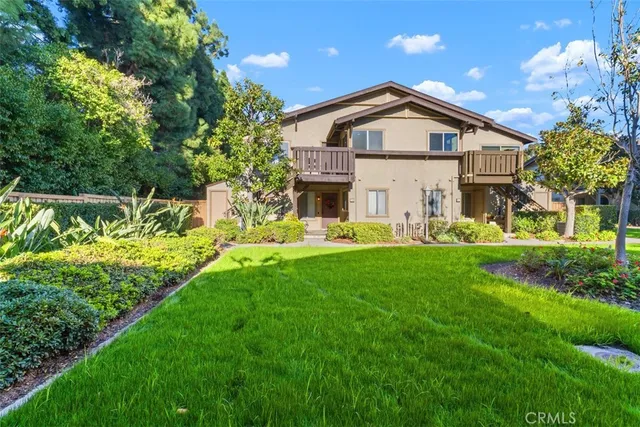 a view of backyard with swimming pool and green space