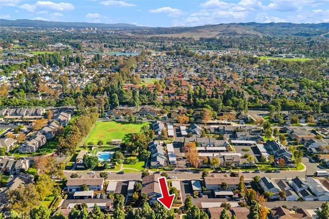 an aerial view of residential building and trees