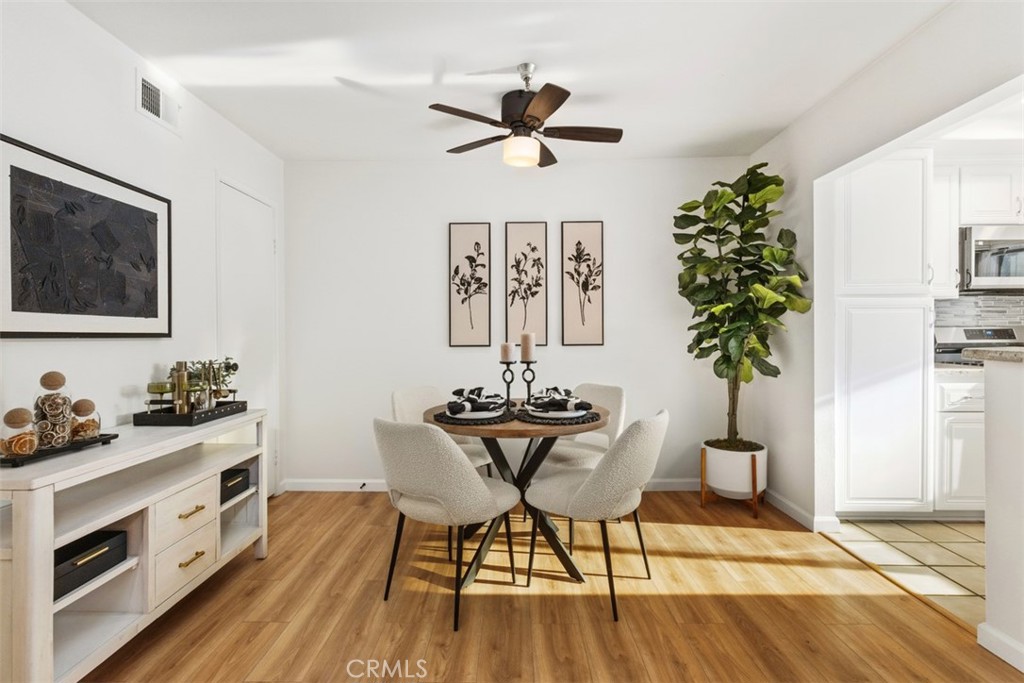 56 Windjammer Irvine, CA 92614 - Photo 6 of 31 a view of a dining room with furniture window and wooden floor