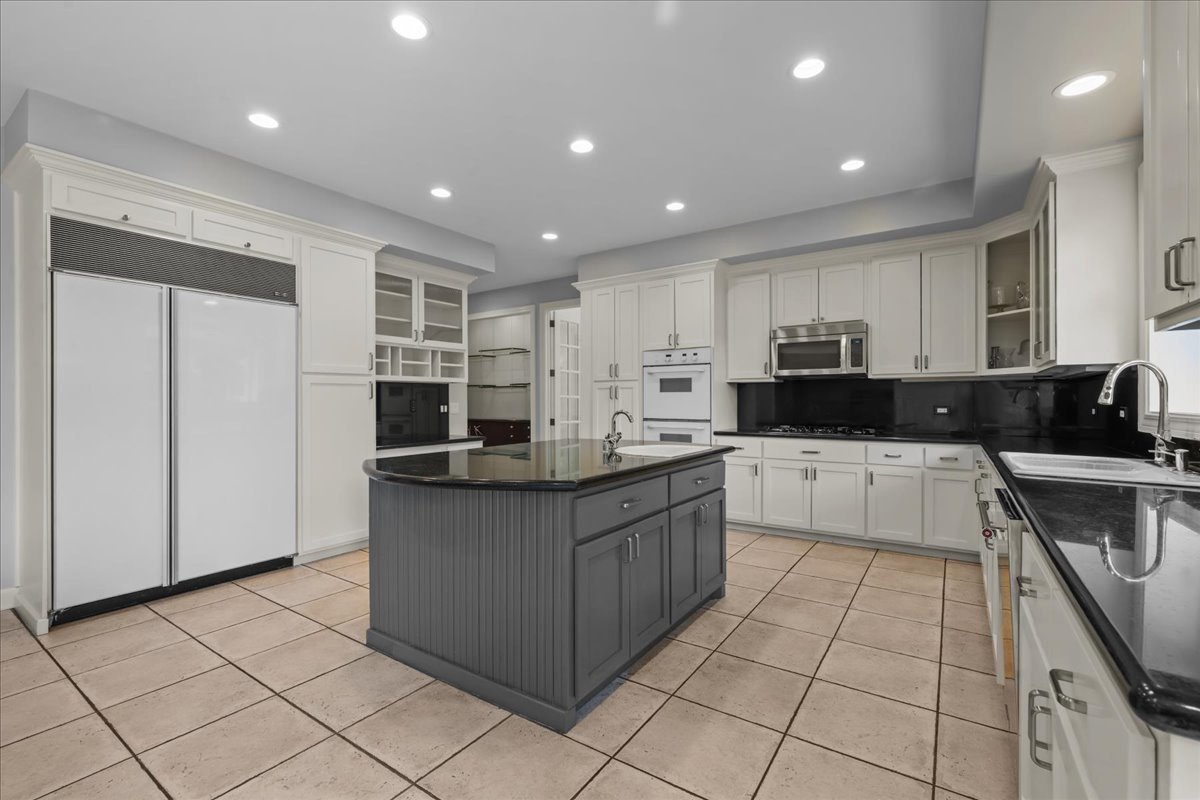101 Crestview Drive Deerfield, IL 60015 - Photo 11 of 37 a large kitchen with stainless steel appliances lots of counter top space cabinets and a sink