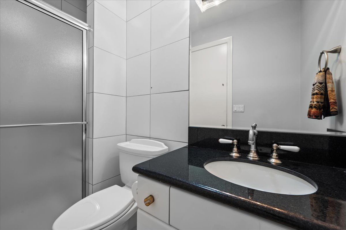 101 Crestview Drive Deerfield, IL 60015 - Photo 18 of 37 a bathroom with a granite countertop sink and a mirror