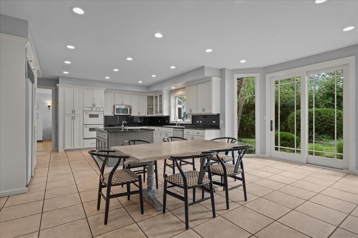 101 Crestview Drive Deerfield, IL 60015 - Photo 10 of 37 a view of a dining room and livingroom with furniture wooden floor and a large window