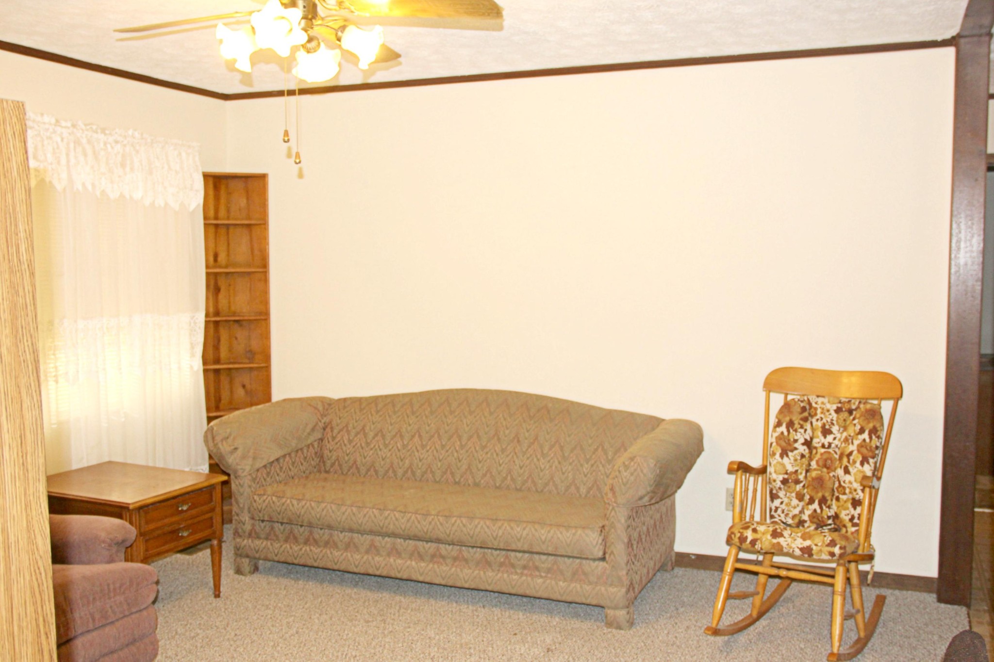653 Laurel Bluff Road Kingston, TN 37763 - Photo 4 of 20 a bedroom with a bed and a chandelier