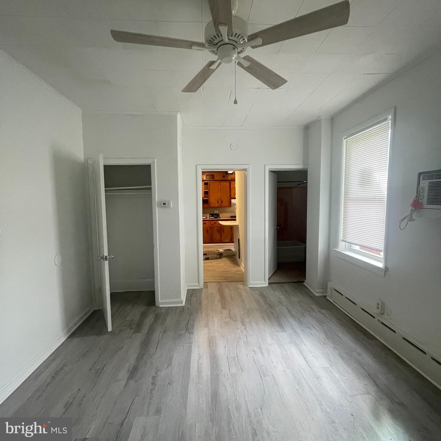 1550 Ruan Street Philadelphia, PA 19124 - Photo 13 of 22 wooden floor in an empty room with a window