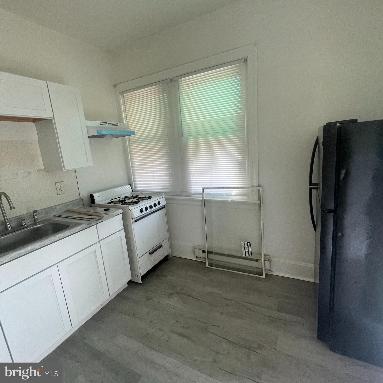 1550 Ruan Street Philadelphia, PA 19124 - Photo 14 of 22 a kitchen with stainless steel appliances a refrigerator and a sink