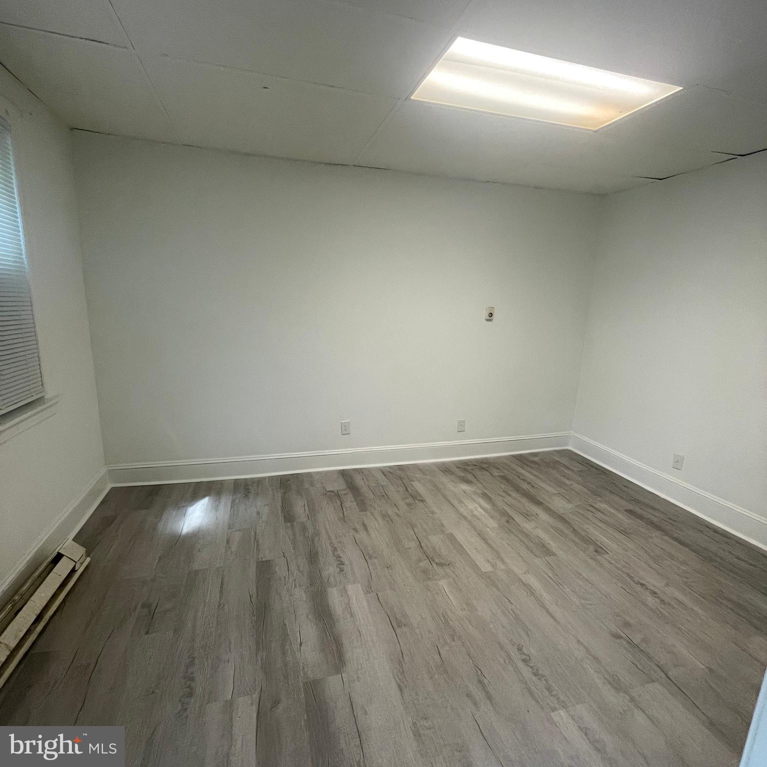 1550 Ruan Street Philadelphia, PA 19124 - Photo 21 of 22 an empty room with wooden floor and windows