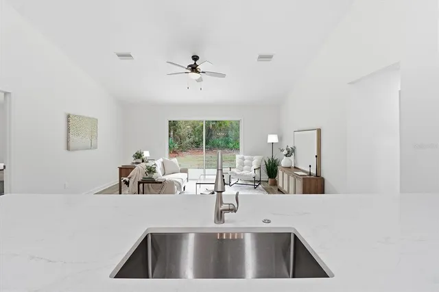 a kitchen with a sink and a window