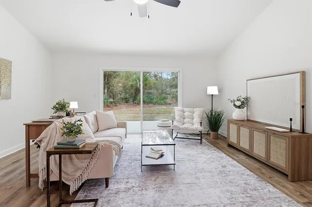 a living room with furniture and a large window