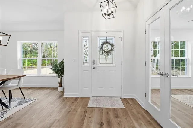 workspace with wooden floor and windows