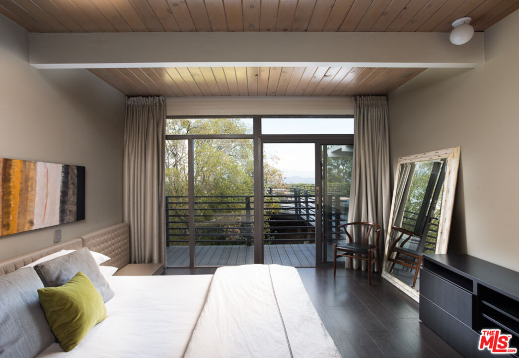 2135 Ridgemont Drive Los Angeles, CA 90046 - Photo 11 of 26 a living room with furniture and a flat screen tv