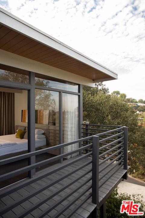 2135 Ridgemont Drive Los Angeles, CA 90046 - Photo 21 of 26 a view of a balcony with floor to ceiling windows