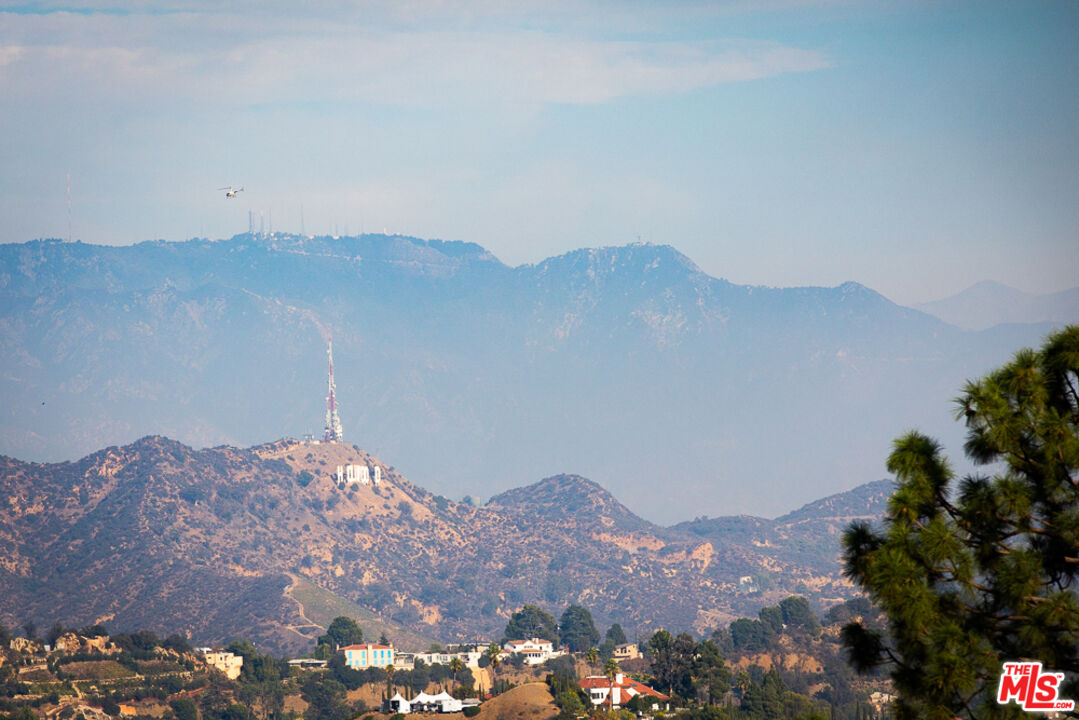2135 Ridgemont Drive Los Angeles, CA 90046 - Photo 23 of 26 a view of a house with a mountain
