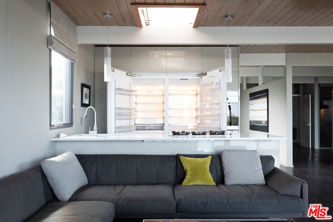 2135 Ridgemont Drive Los Angeles, CA 90046 - Photo 7 of 26 a living room with kitchen couches and kitchen view