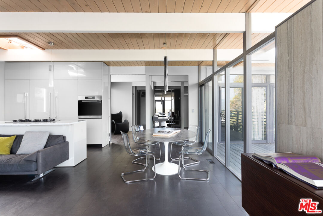 2135 Ridgemont Drive Los Angeles, CA 90046 - Photo 9 of 26 a view of a dining room with furniture window and outside view