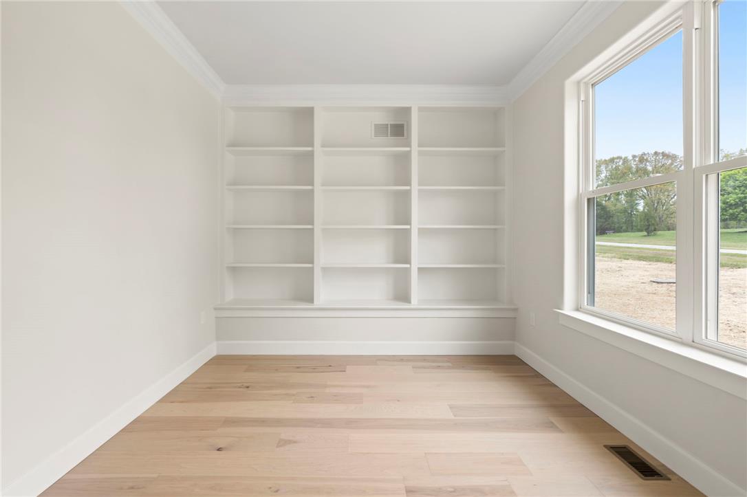 Hottle Road Quakertown, PA 18951 - Photo 22 of 59 Custom built-in bookcases and classic crown molding accent this versatile study featuring warm wood floors.