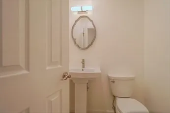 a bathroom with a toilet and a sink