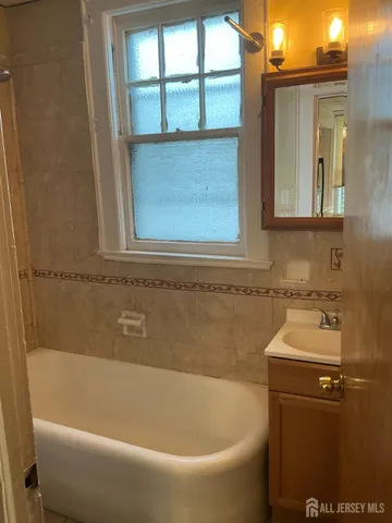a bathroom with a sink and a bathtub