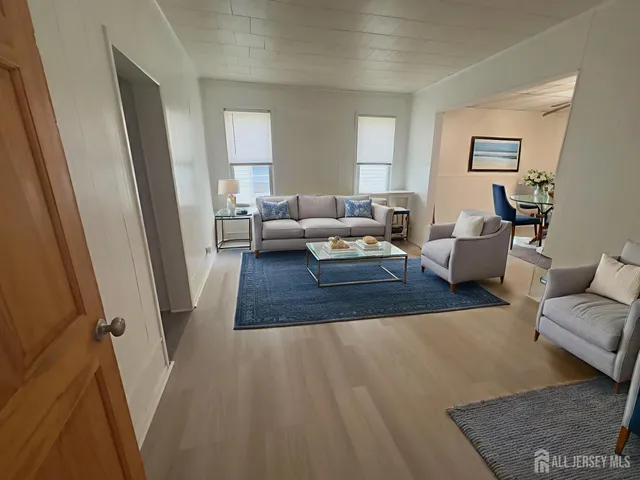 a living room with furniture and a rug