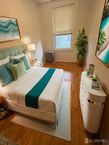 a bedroom with bed and window