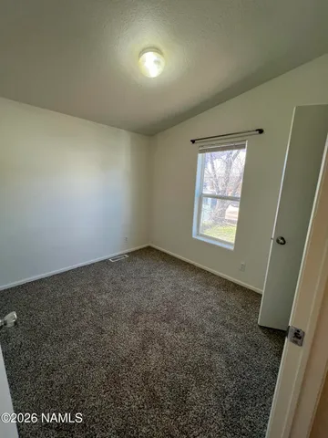a kitchen with a sink and a stove top oven