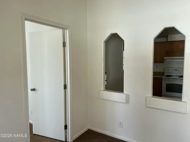 a bathroom with a sink toilet and a mirror