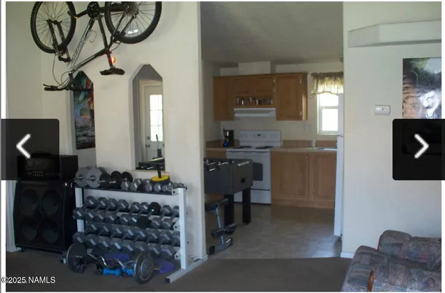 a view of hall way with furniture and mirror