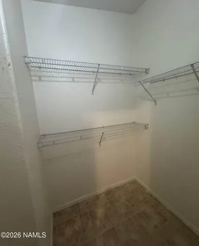 a view of a room with racks on the wall