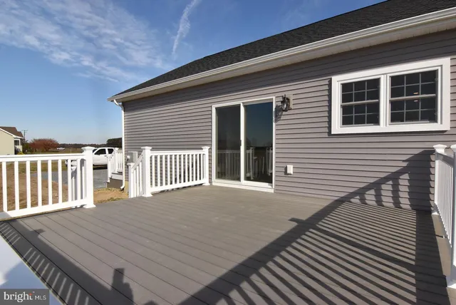 a view of a house with wooden deck
