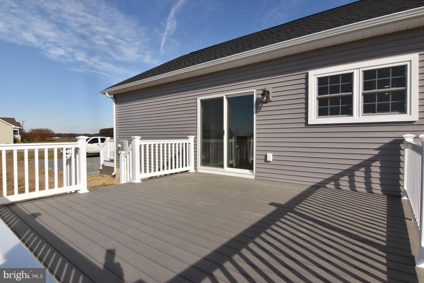 36078 Columbia Road Delmar, DE 19940 - Photo 18 of 20 a view of a house with wooden deck