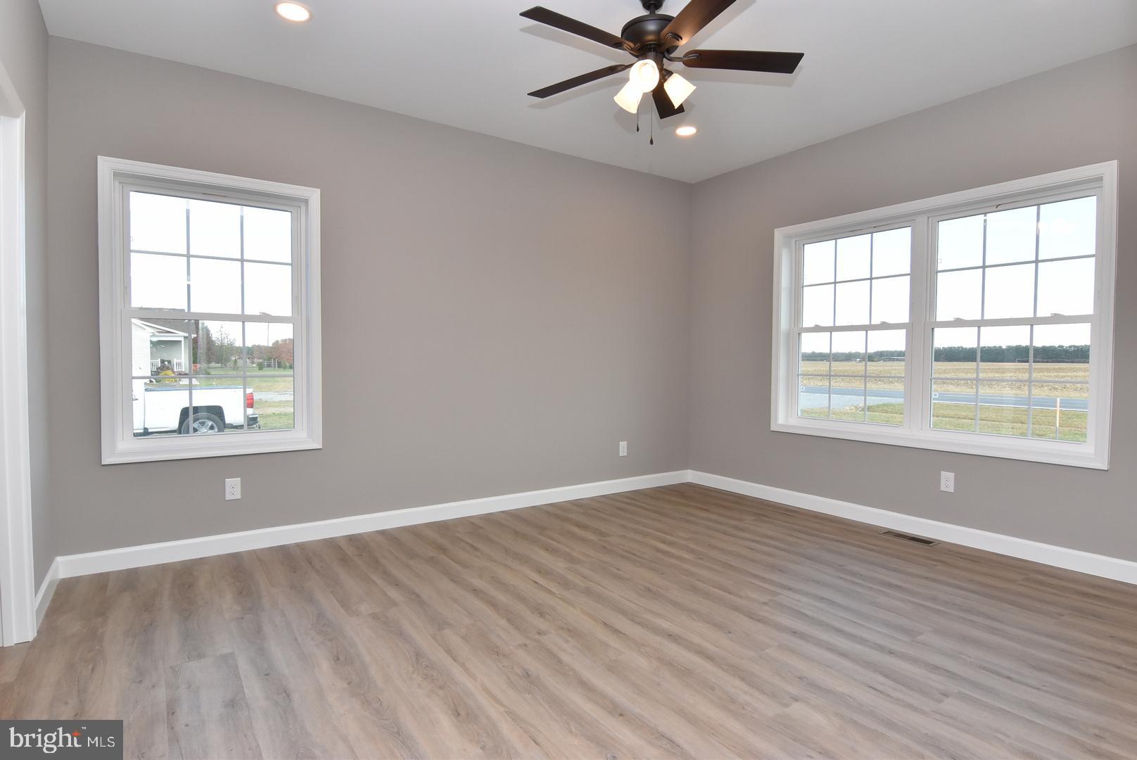 36078 Columbia Road Delmar, DE 19940 - Photo 8 of 20 wooden floor in an empty room with a window