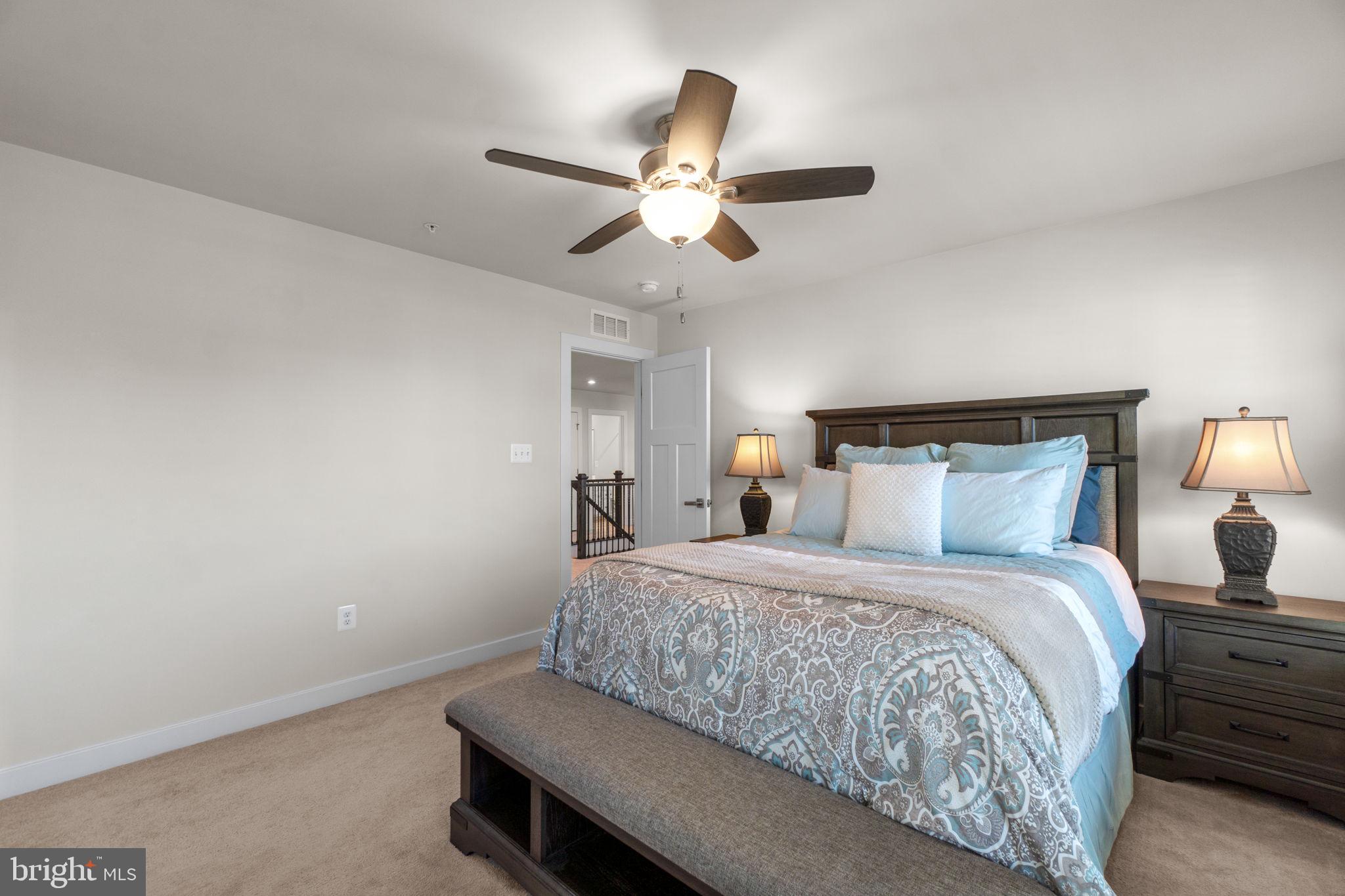 5245 Red Maple Drive Frederick, MD 21703 - Photo 24 of 49 a bedroom with a bed and a ceiling fan