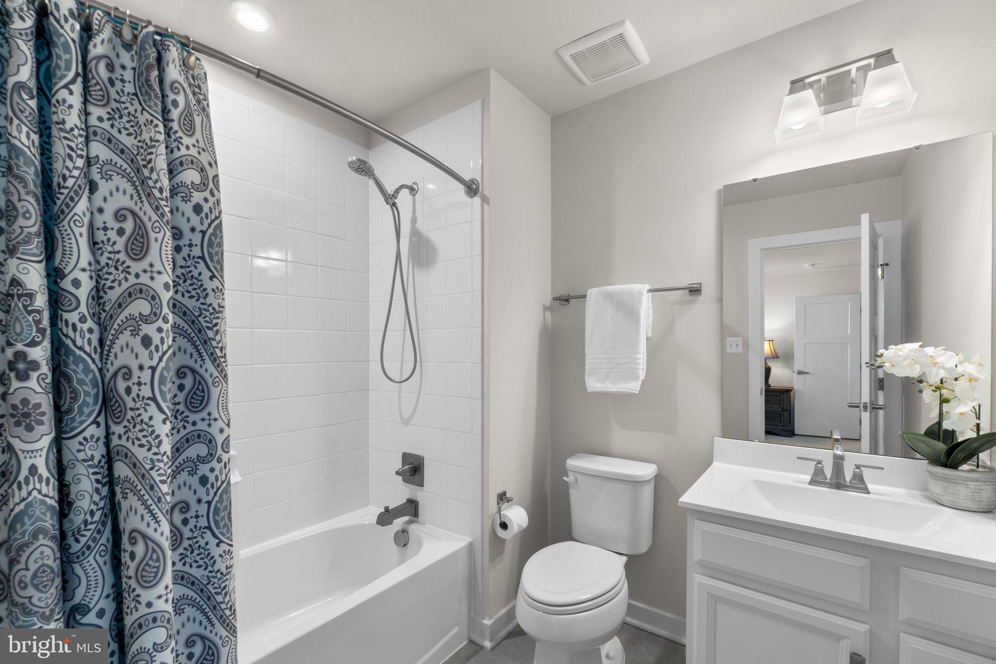 5245 Red Maple Drive Frederick, MD 21703 - Photo 25 of 49 a bathroom with a toilet sink vanity tub and shower