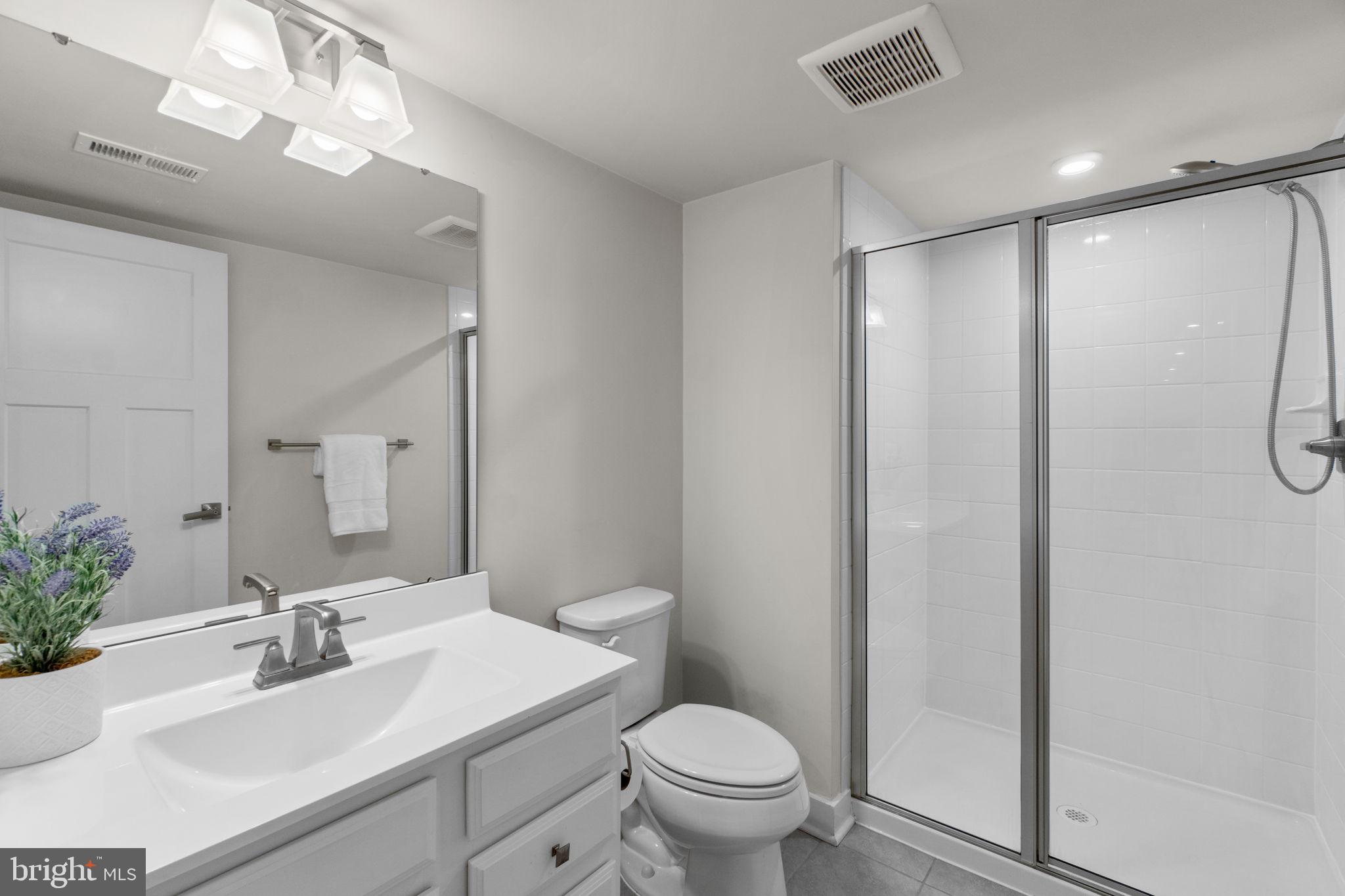 5245 Red Maple Drive Frederick, MD 21703 - Photo 35 of 49 a bathroom with a sink toilet and shower