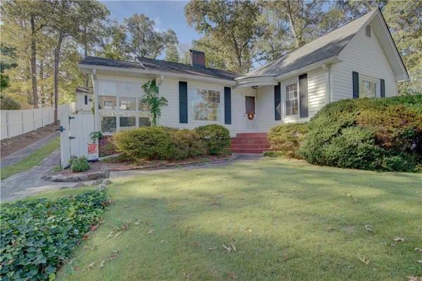 front view of a house with a yard
